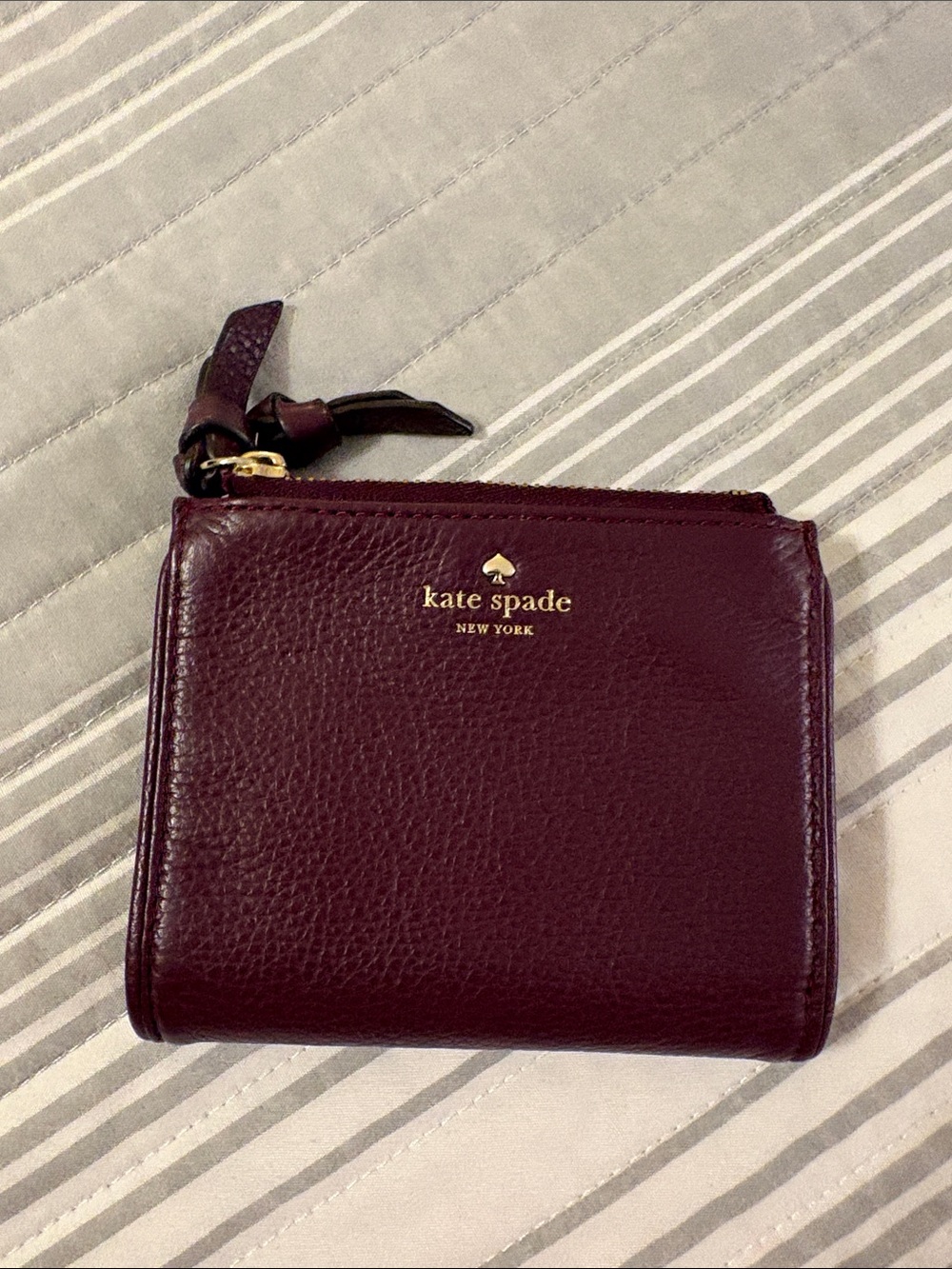 kate spade burgundy leather wallet with 2 zippered pockets